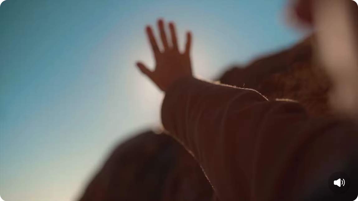 Hand reaching into the sky